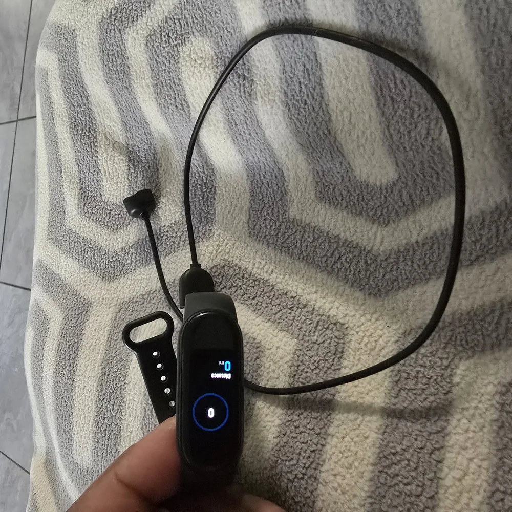 Smart Fitness Tracker with Black Band W/Charge Cable.